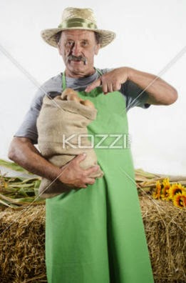 Organic Farmer With Some Freshly Harvested Potatoes